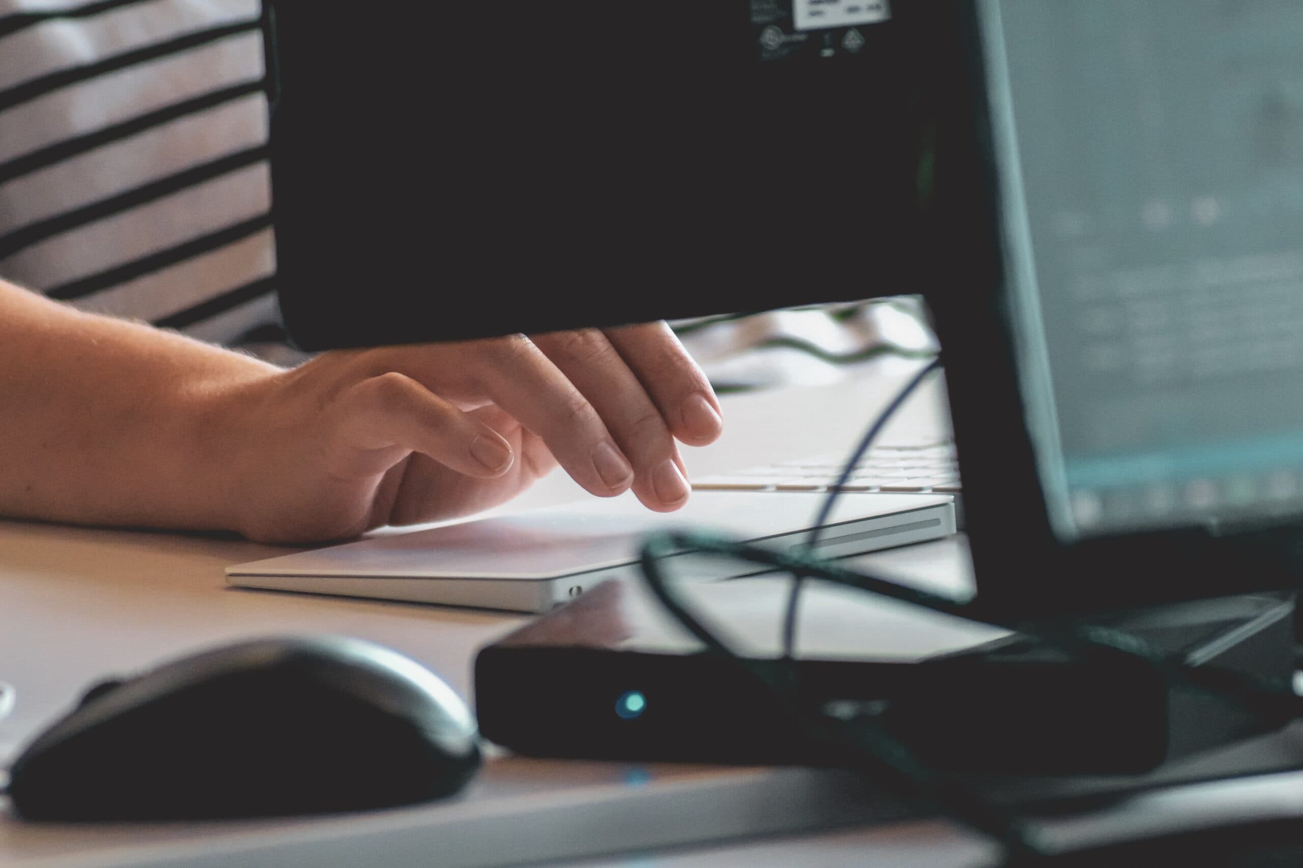 up close of a hand typing on a computer keyboard