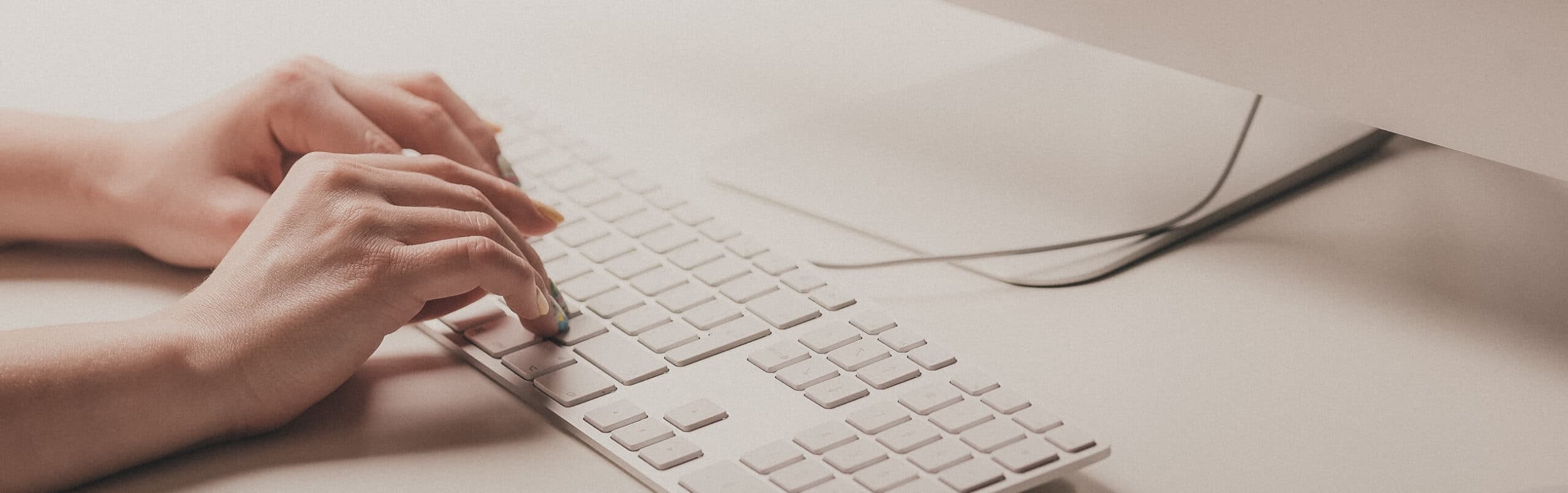 Person using Mac keyboard