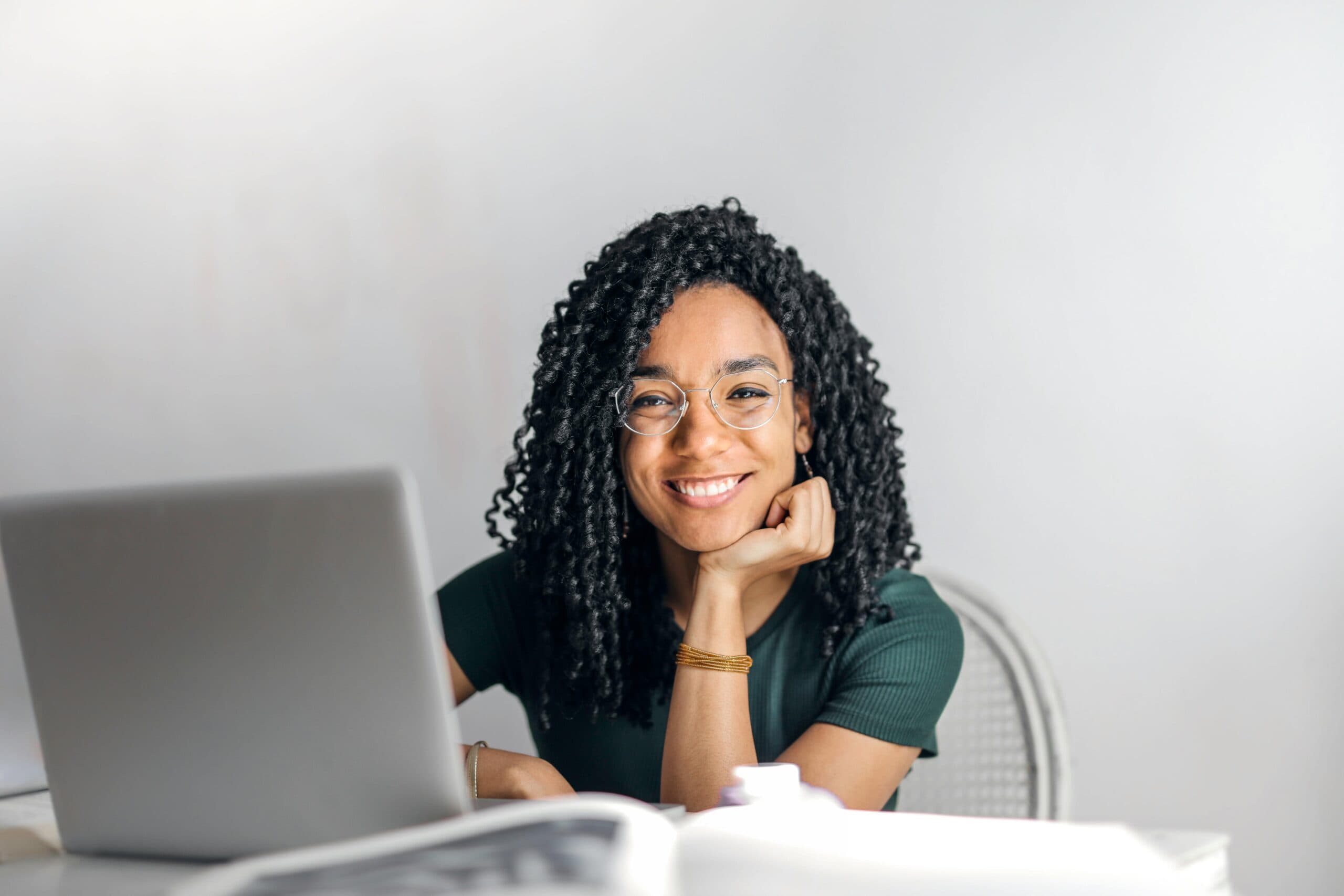 student sitting at her laptop