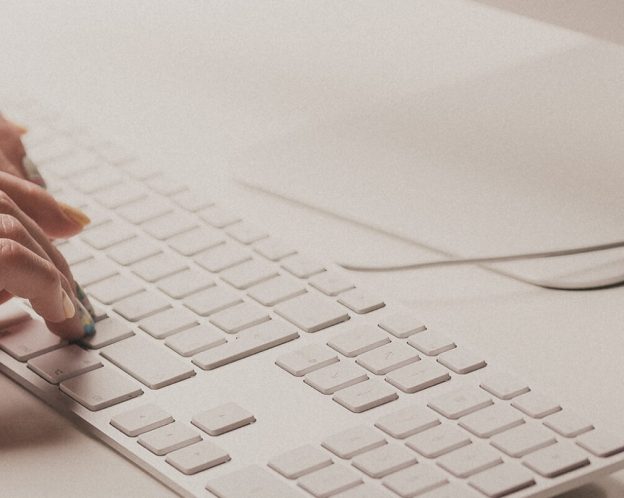 Person using Mac keyboard