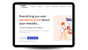 Hotjar's value proposition, 'Everything you ever wanted to know about your website but your analytics never told you', on a tablet screen.